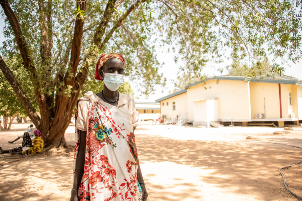 A woman outside of a hospital in South Sudan.