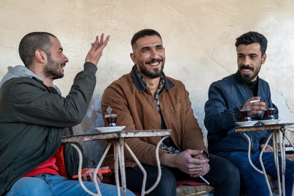 Three men in a bar in Mosul, Iraq.