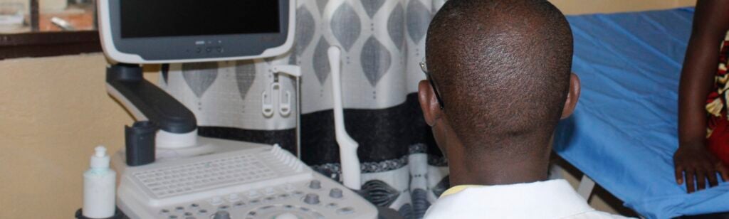 A doctor performing an ultrasound in a Burundian hospital.