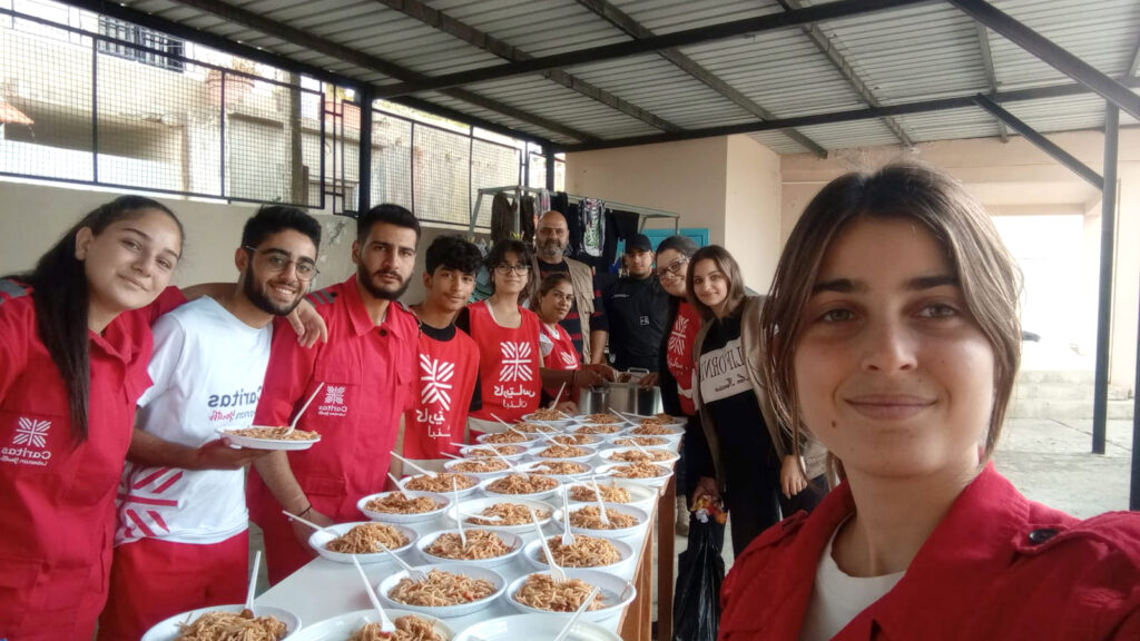 Caritas Lebanon team preparing food for the war-affected population