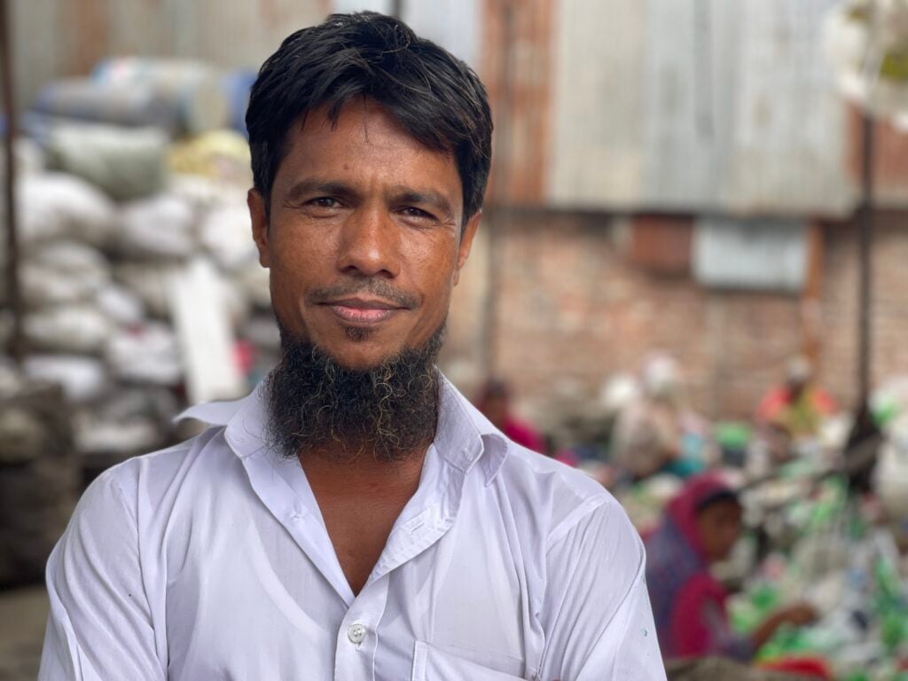 man in white shirt looking in camera