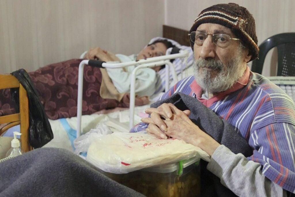 man in care center holding bread