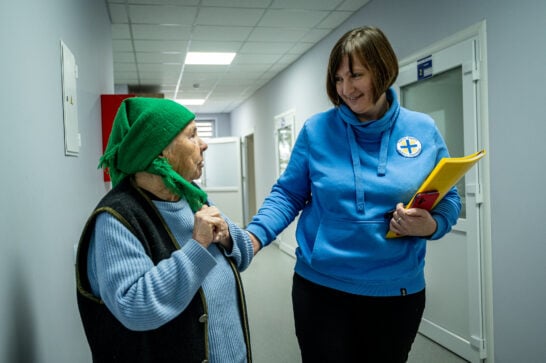 Ukrainian health worker and a patient in medical centre in Voinyliv.