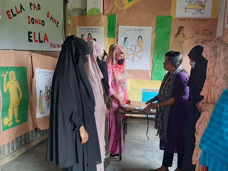 women discussing menstruation and hygiene in a school